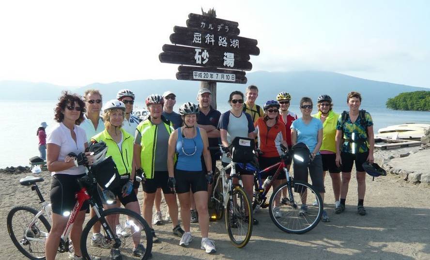 Resting the legs for a group photo in Hokkaido