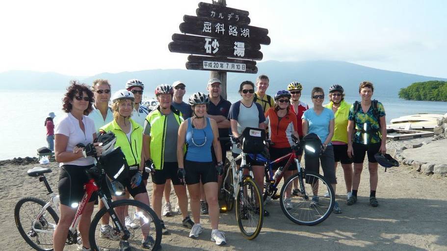 Resting the legs for a group photo in Hokkaido