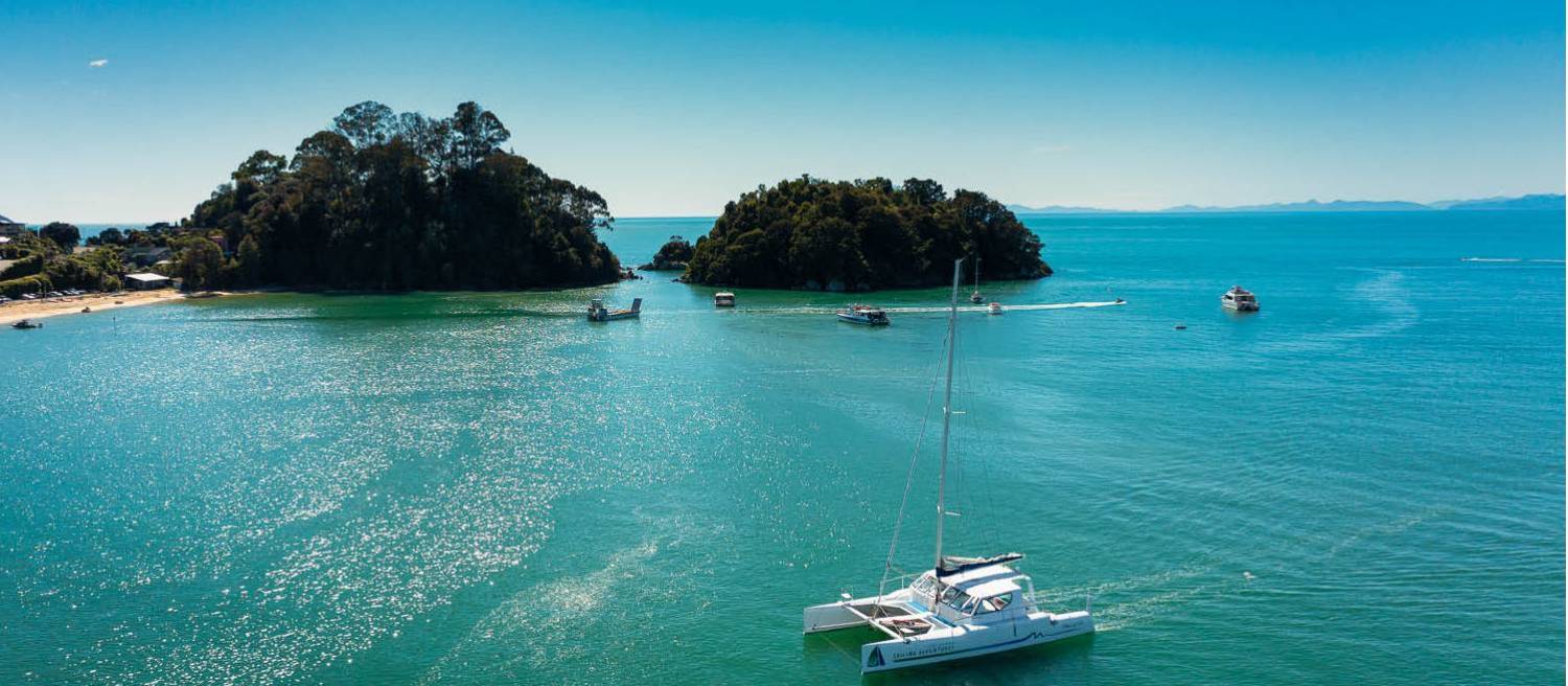 Cruising through the stunning bays of the Abel Tasman by Catamaran.