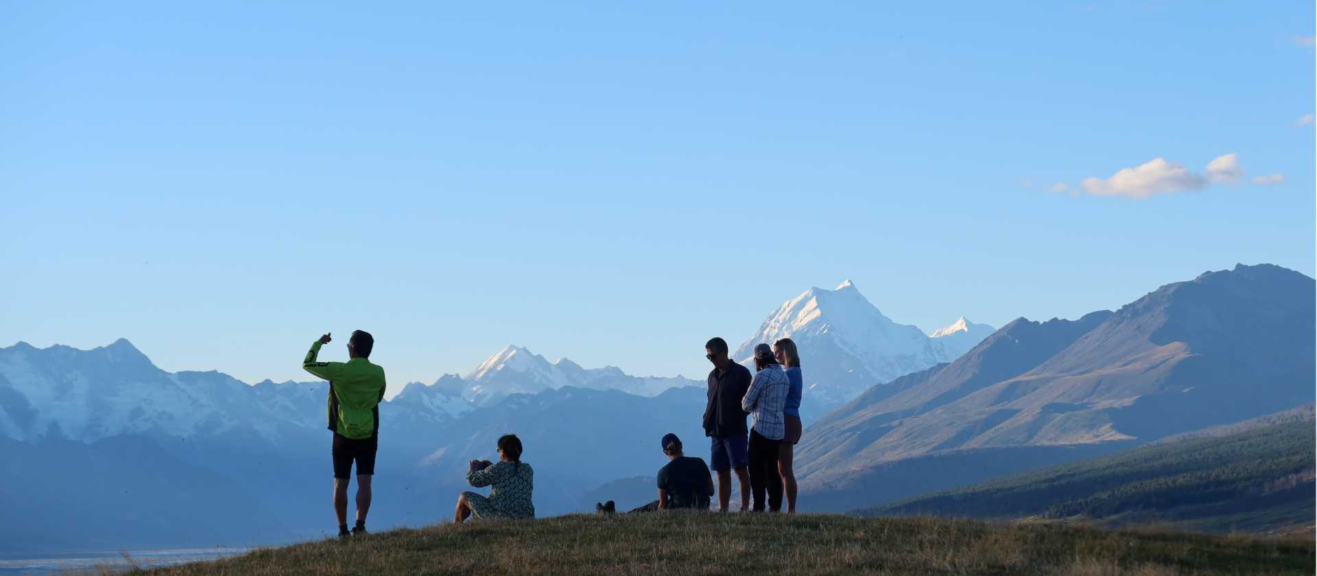 Cycling along Lake Pukaki on the Alps to Ocean End to End with Adventure South. | Guide Collie