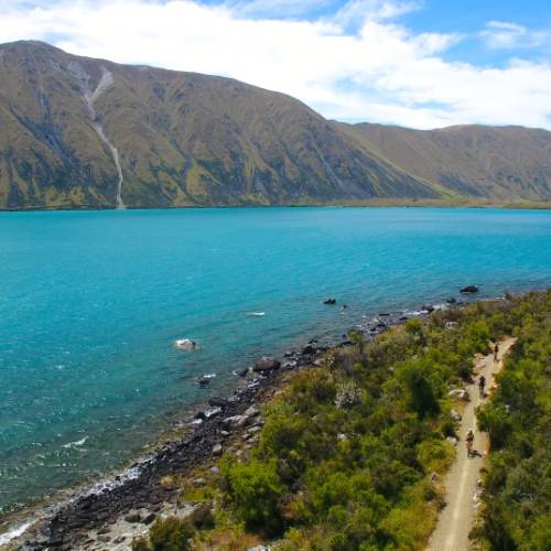 Cycling alongside Lake Ohau