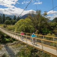 A purpose-built suspension bridge takes us across the pretty Baton River | Chocolate Dog Studio