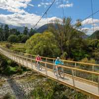 A purpose-built suspension bridge takes us across the pretty Baton River | Chocolate Dog Studio