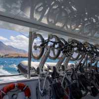 Adventure South bikes lined up in vertical racking aboard the Real NZ ferry from Walter Peak Station to Queenstown at the end of the Around the Mountains cycle trail. | Izzi Barton