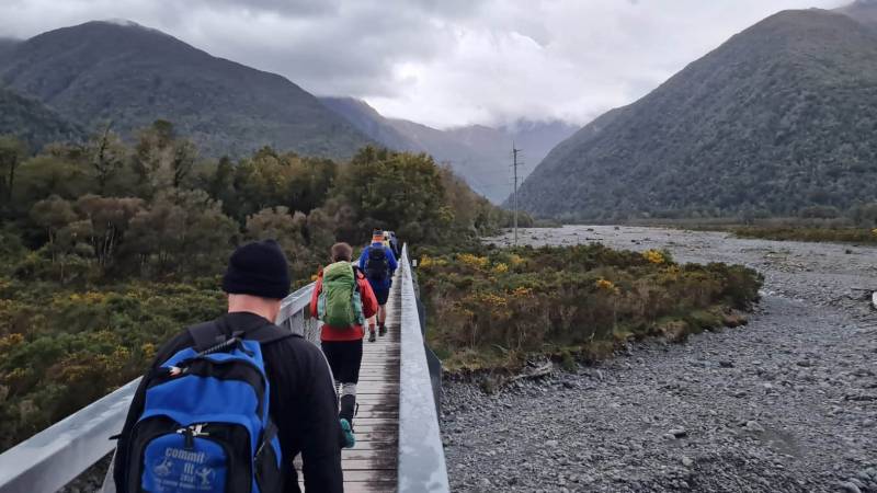 Heading over Morrison's Footbridge over the Otira River before taking on Goat Pass. |  <i>Adventure South NZ</i>