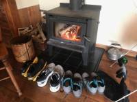 Drying our shoes by the fire after a wet day on the trail! |  <i>Elaina Culbert</i>