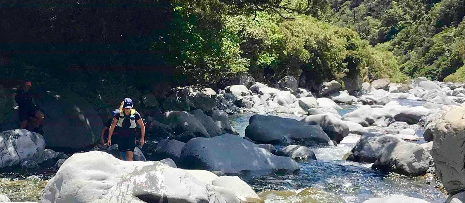 Climbing over boulders in Goat Pass, NZ | Lisa Jones