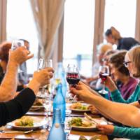 Celebrating with fine food and wine after a good day's ride | Lachlan Gardiner
