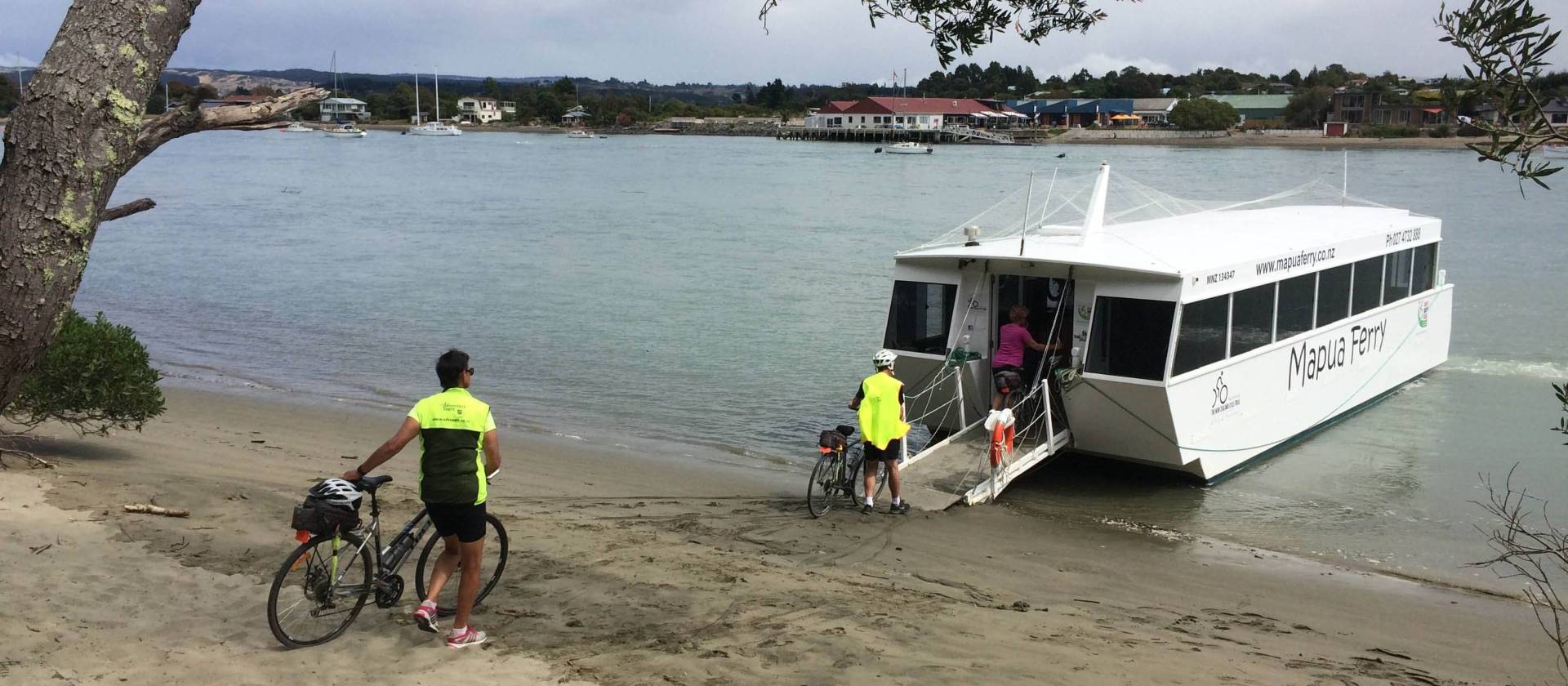 Boarding the Mapua Ferry after a stunning ride on Rabbit Island | Chris Cameron