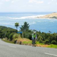 Road cycling along the coastline of Northland New Zealand