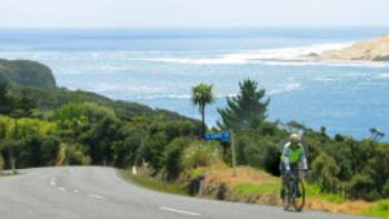 Road cycling along the coastline of Northland New Zealand