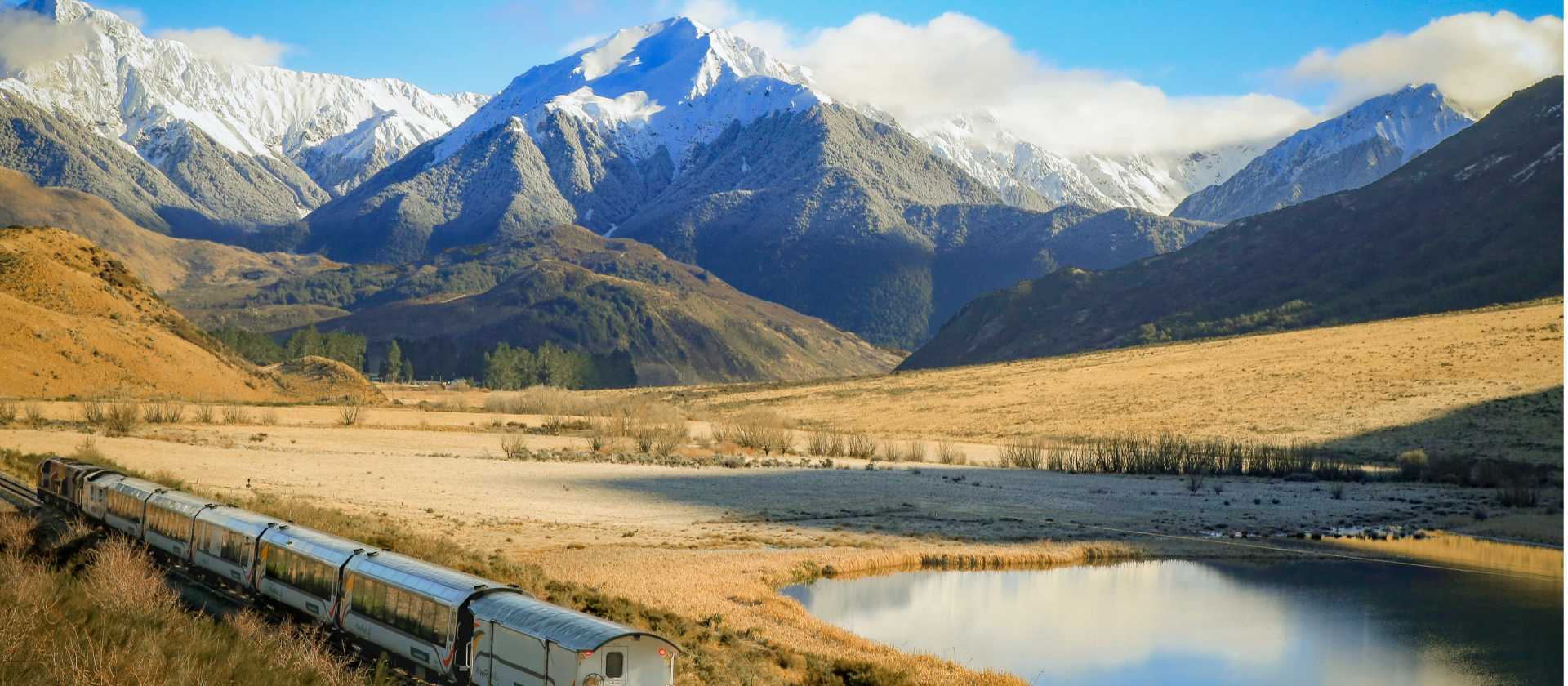 Glide through the towering Tiritiri-o-te-moana / Southern Alps aboard the TranzAlpine — a spectacular prelude to your West Coast cycling journey. | Jay French