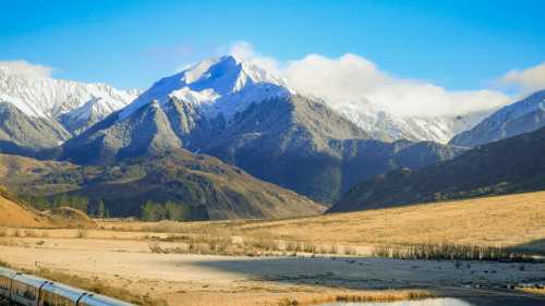 Glide through the towering Tiritiri-o-te-moana / Southern Alps aboard the TranzAlpine — a spectacular prelude to your West Coast cycling journey. | Jay French