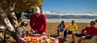 Cyclists about to tuck into a fab lunch prepared by Geoff | Colin Monteath