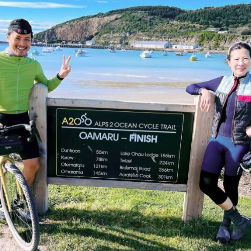 Cyclists at end of the Alps to Ocean