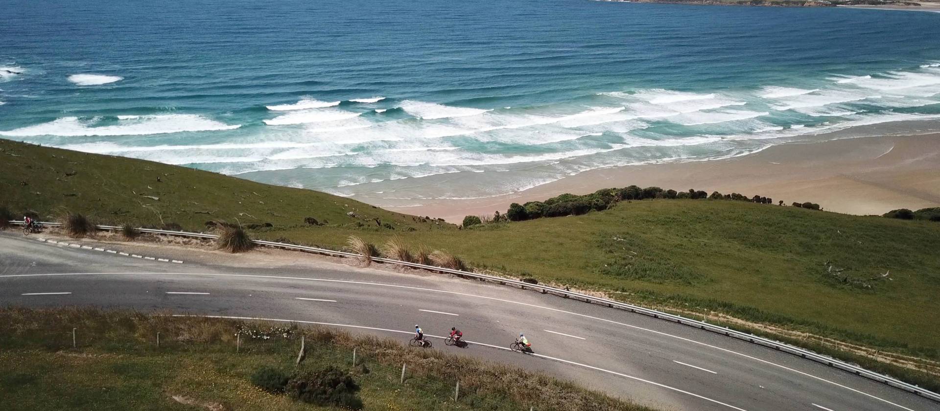 Road cyclists making their way around Papatowai Beach | Reiner Schuster