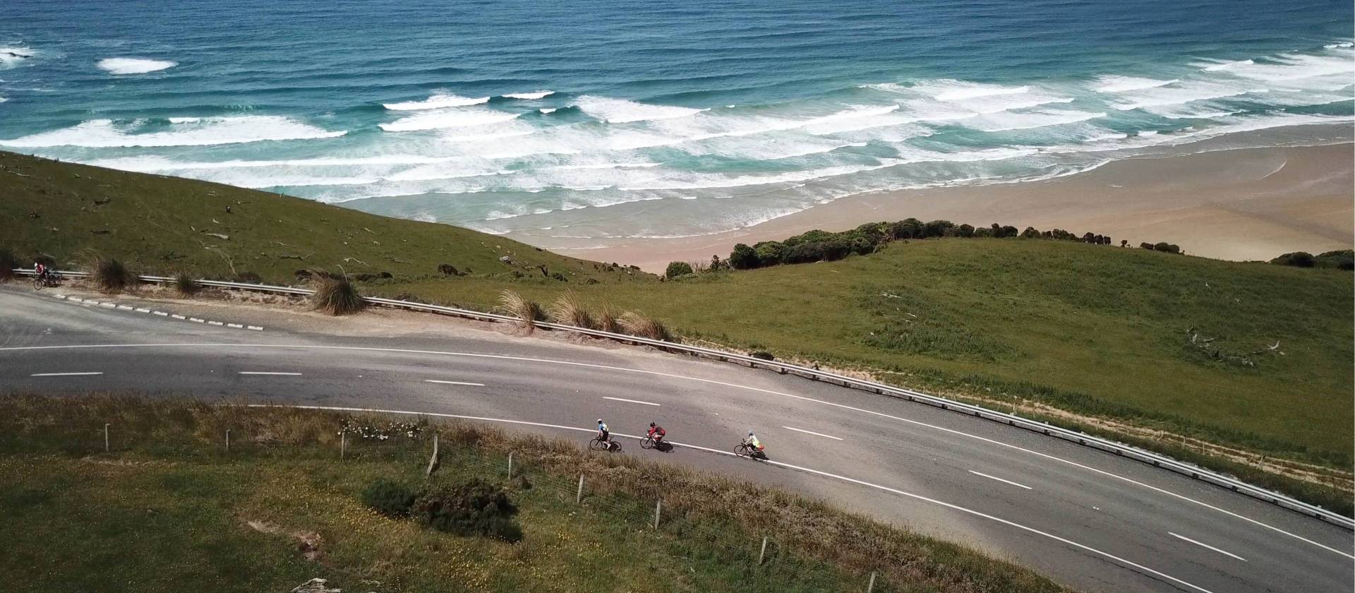 Road cyclists making their way around Papatowai Beach | Reiner Schuster
