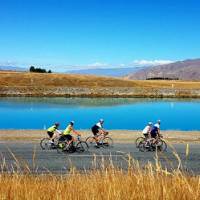 Cycling group enjoying views of the turquoise Hydro-Canals near Twizel. | Rossco Daubney