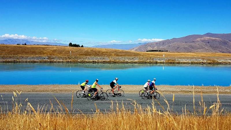 Cycling group enjoying views of the turquoise Hydro-Canals near Twizel. |  <i>Rossco Daubney</i>