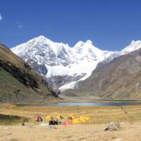 Camping amongst the rugged snowcapped peaks of Huayhuash, Peru | Ken Harris