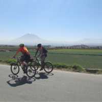 Cycling on quiet rural roads near Arequipa, El Misti towering in the background | Louise Vargaya Conza