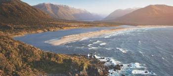 Aerial view over Long Reef and Martin's bay on the Fiordland, Hollyford and Stewart Island Trek | Hollyford Track