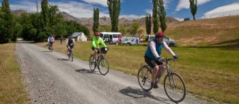 Cycling away from Cob cottage and a snack spot on the Molesworth High Country tour | Colin Monteath